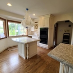 Small offset island for breakfast nook and socializing.