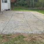 Dug up, leveled, gravel put down and compacted. Formed and outlined. Use rebar for reinforcement.