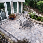 A square cut paver patio looks more formal, and the dark paver border really helps to define the space.