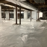 we wrapped the walls, floors and columns to control vapor. there is an underlayment to allow for walking in the area.