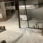multiple dehumidifiers keep the area dry. barrel stonework supports the massive church