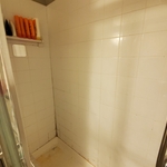 Water damage and separation of tile base.