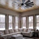 Empire Painting transformed this cozy sunroom space using beige wall paint from Sherwin Williams and a slightly darker tone in a similar shade for the trim surrounding the windows, which provide a pleasant contrast to this space.
Mid-sized elegant medium tone wood floor and brown floor sunroom photo in Milwaukee with no fireplace and a standard ceiling