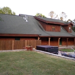 back of house before restaining and new roof