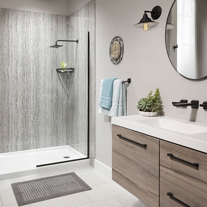 Shower with concrete wall pattern and black fixtures