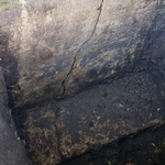 Leaky Crack in Basement exposed from outside. Dirt and stone is removed down to footing.