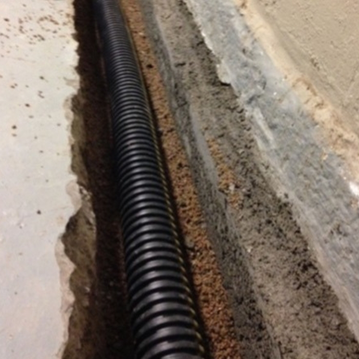 Basement waterproofing in progress