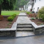 Sidewalk, retaining wall, plantings