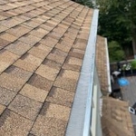 Home in Arlington, VA. protected from leaves and water controlled with our gutter guards.