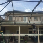Remove super gutter, re pitch gutter, cut down screen walls, re seal, and Rescreen. ( water was getting behind gutter and ruining stucco and drywall.