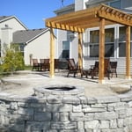Stamped Patio, Stone Sitting Wall, and Custom Built Pergola