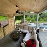 The articulating arm allows the TV to be rotated toward the swimming pool.