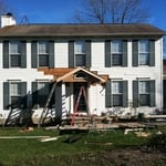 Before portico, siding, and roof
