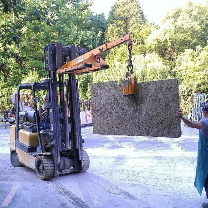 Moving granite tops over to the truck to be loaded for installation