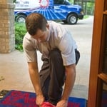 Tech using the shoe covers