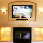 TV and Soundbar Mounted Above Fireplace