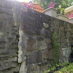 Large crack in retaining wall that was incorrectly fixed by filling it with concrete.