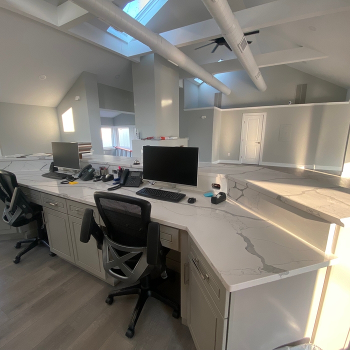 Today's modern office reception area. This top is called Calacatta Trevizo Quartz.