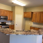 Rebuilt/Redesigned all lower cabinets to match existing. Removed laminate countertop and replaced with granite. Replaced old stainless shallow sink with new updated farm-style sink