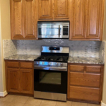 New oven. New granite. Refurb/Rebuilt lower cabinets to match existing. New coats of paint as well.