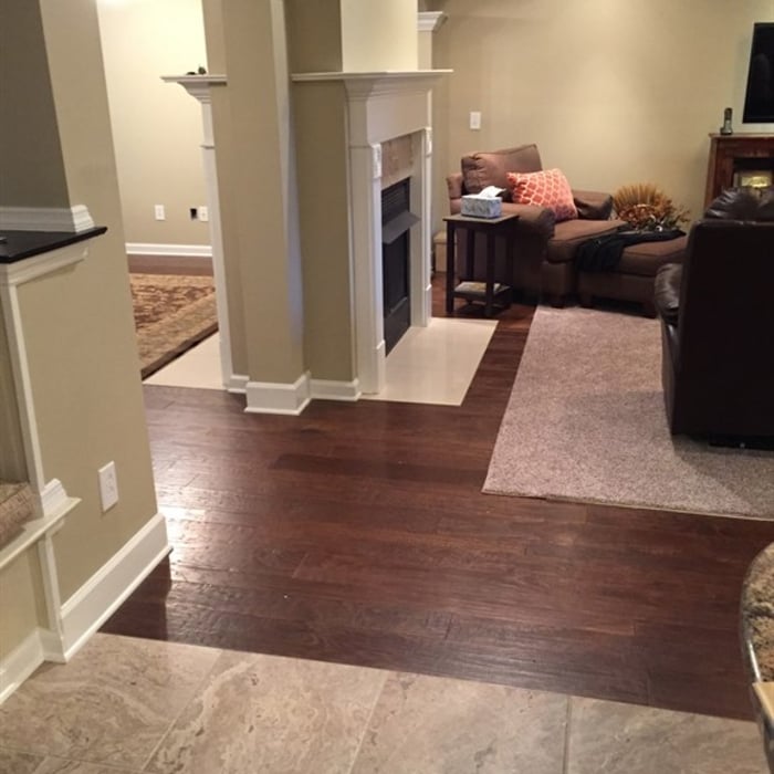 Handscraped Engineered Hardwood. Also Installed Tile in Kitchen and two Fireplaces