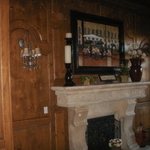 Stone Fireplace mantel and custom raised panel wood paneling