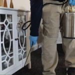 Baseboard spray beneath furniture