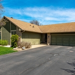 Before- Hail damaged roof siding and gutters