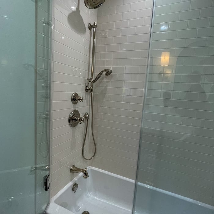 Professionally installed tile, shower head and hand wand