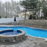 Pool Area with Large Wall