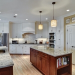 Cabinetry, Appliances and Natural Stone Choices Bring Life to Kitchen