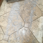 Dirt scrubbed up on travertine floor