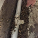 Internal drain system the connection is a bleeder that next to the storm drain or sump pump