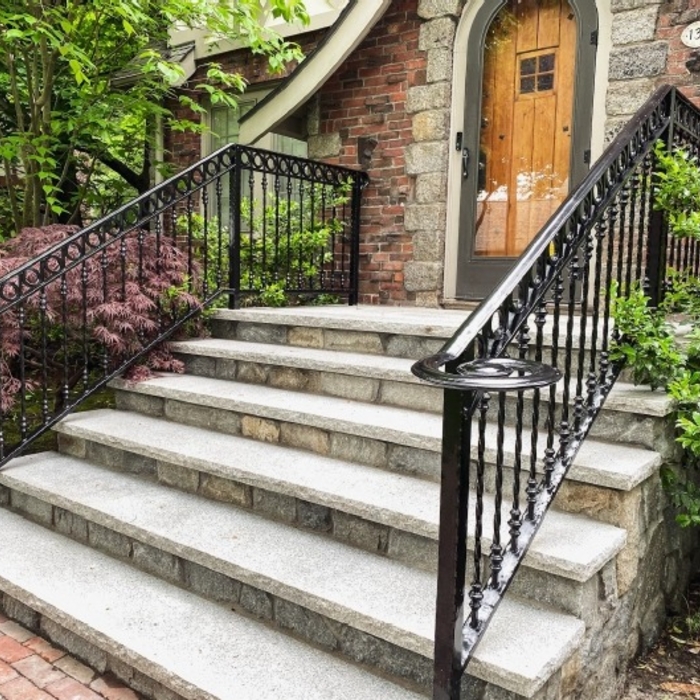 Detailed and galvanized front step railings.