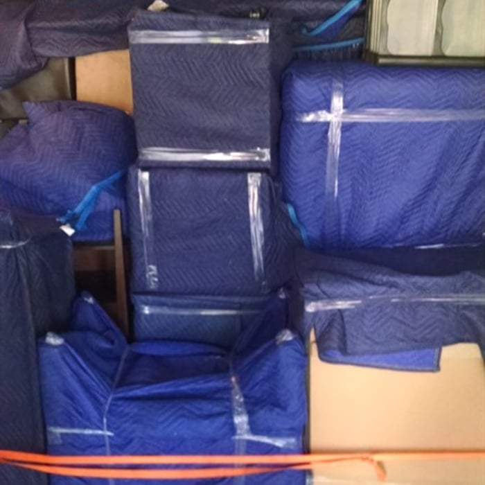 Again, showing how we professionally wrap and tightly stack your furniture.