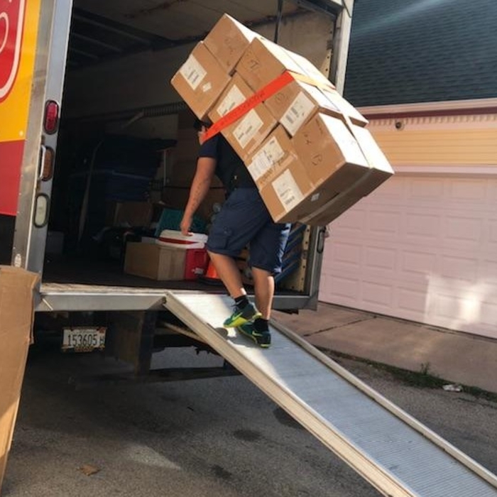 Carrying boxes.