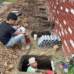 Steel ICC Certified Push Piers being installed