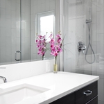 Modern faucet fixture on under mount sink in quartz countertop