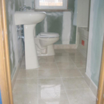 Remodel Bathroom with hot tub, surround shower, pedistal sink, toilet, med. cabinet, marble tile floor.