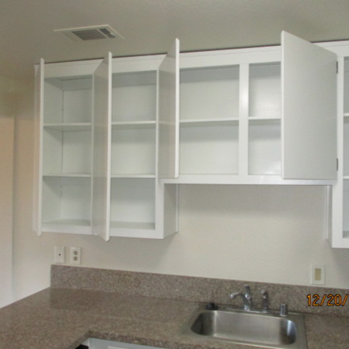 All hardware removed from cabinets. Cabinets sprayed with Dunn-Edwards ULTRA-Premium Aristoshield oil-hybrid semi-gloss paint for extreme hardness durability, and an oil-like finish. All cabinet hardware reinstalled.