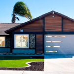San Bernardino home after installation of rainscreen siding and black vinyl-clad aluminum trim.