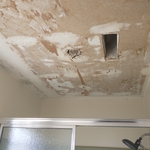 Previous homeowners used cheap popcorn patch instead of properly installing a fan and scraping which lead to paper deterioration during the popcorn scrape.