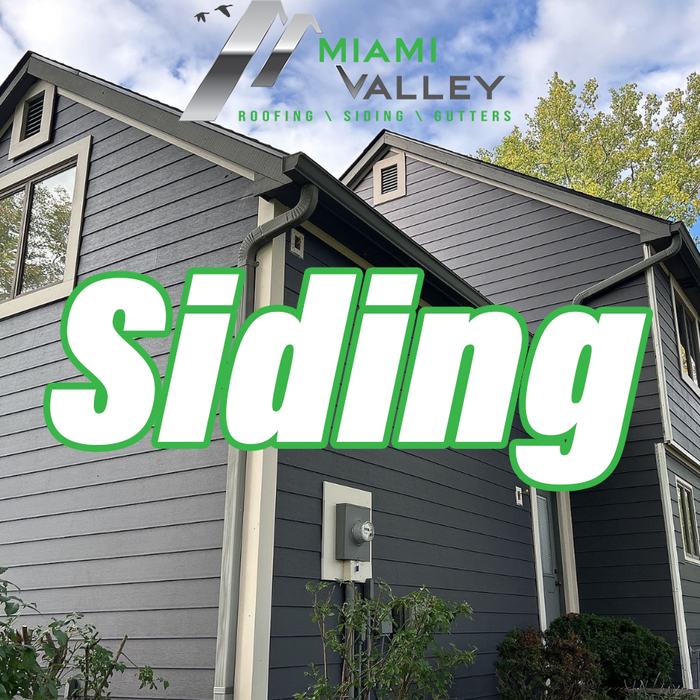 An image capturing a house freshly enhanced with new siding installed by Miami Valley Roofing & Restoration LLC. The picture showcases the transformed exterior of the residential property, highlighting the quality and aesthetic appeal of the siding material chosen. The new siding envelops the house, providing a modern and refreshed look that elevates the home's curb appeal. The craftsmanship of Miami Valley Roofing & Restoration LLC is evident in the precision of the installation, with each pan