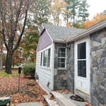 Before - Complete exterior rehab with vinyl siding installation and pergola extension with metal roofing