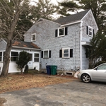 Before removal of the old, outdated siding amongst the entire exterior of the home.