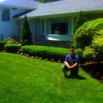 My son planting flowers, and applying mulch in Newton, Ma.