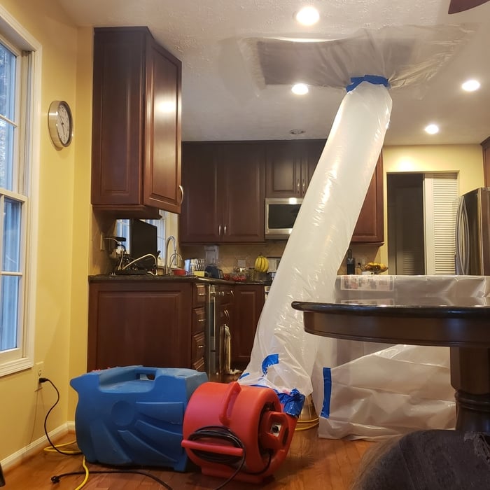 Drying bathroom wood subfloor from kitchen using indirect control heat, controlled by thermostat we set in place