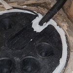 The sump pump lid was sealed to prevent radon gas from using that opening as an entry point into the basement.
