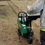 Cutting out Paul's grass with a sod cutter before we start digging
to install 4" PVC drain pipe