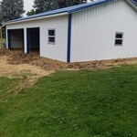 A 8 foot wide lean to on the north and west side of the pole barn